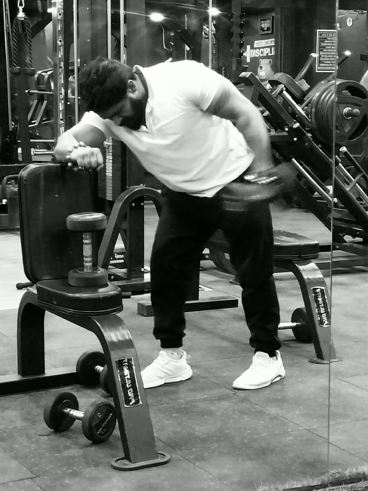 Sanjay Purbia performing a dumbbell row